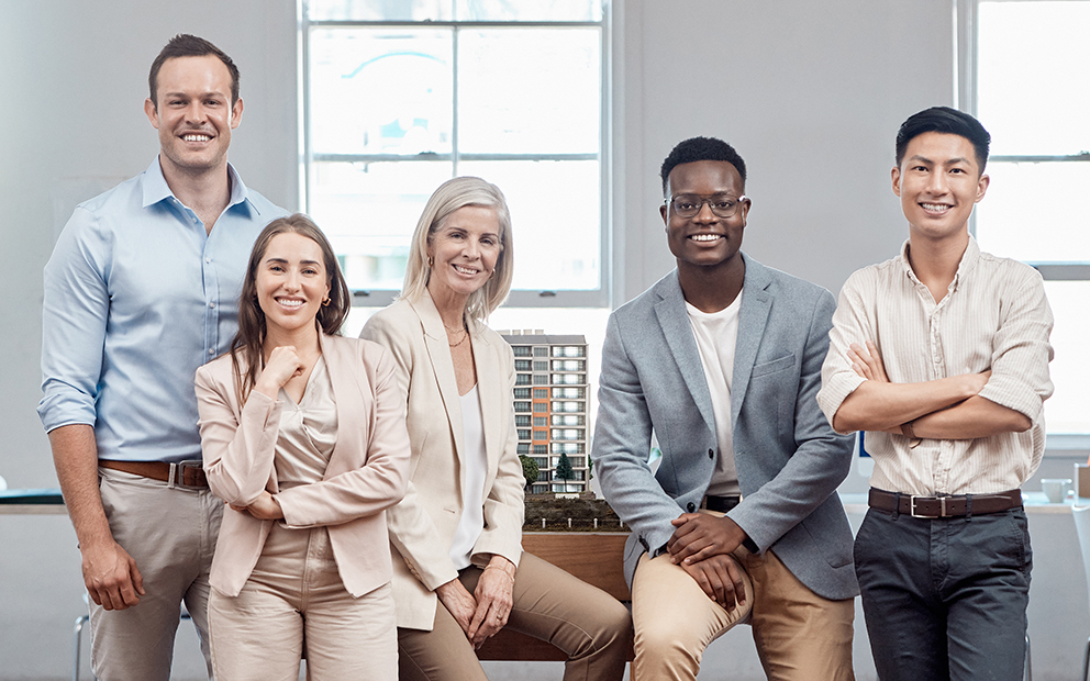 Group of professionals sitting and standing together